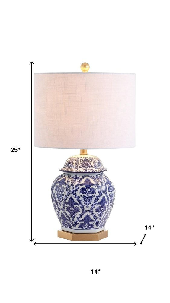 25" Gold Novelty Table Lamp With Drum Shade. Table lamp isolated on a plain white background.