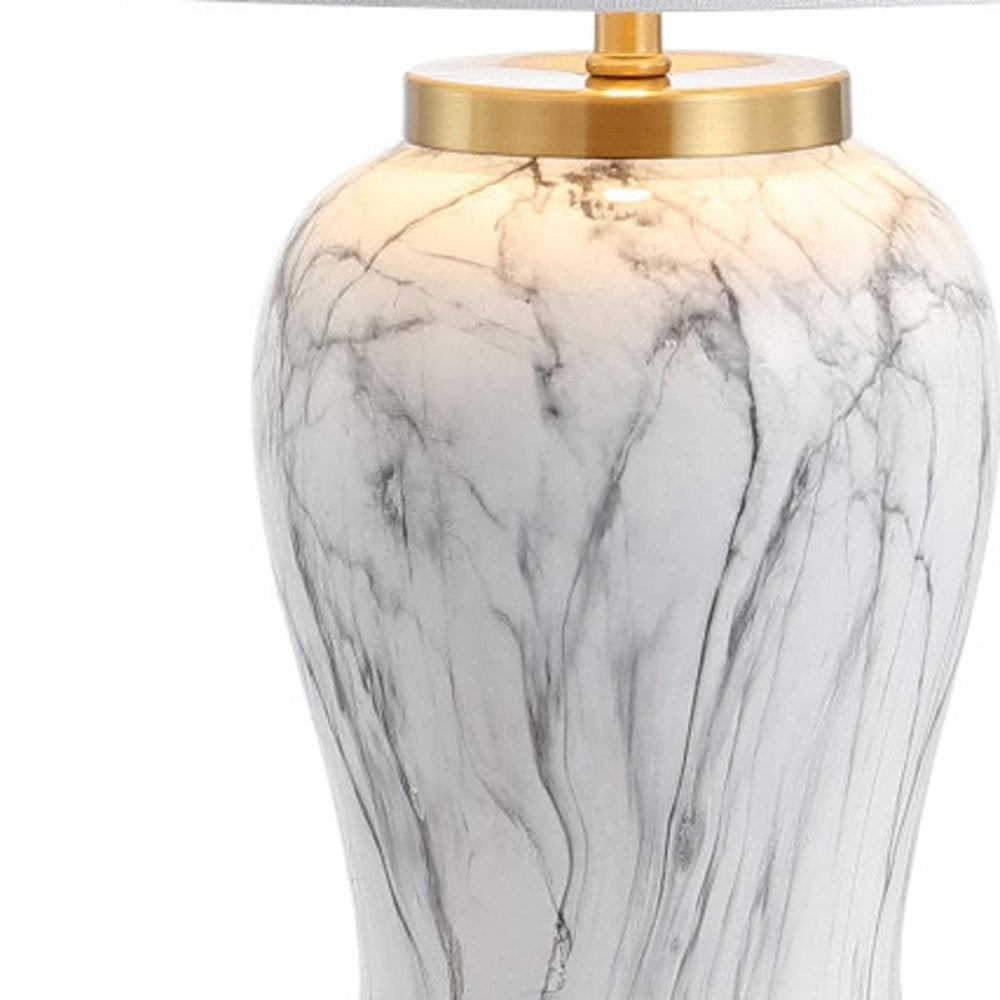 28" Gray White And Gold Urn Table Lamp With Empire Shade. Table lamp isolated on a plain white background, finished in white.