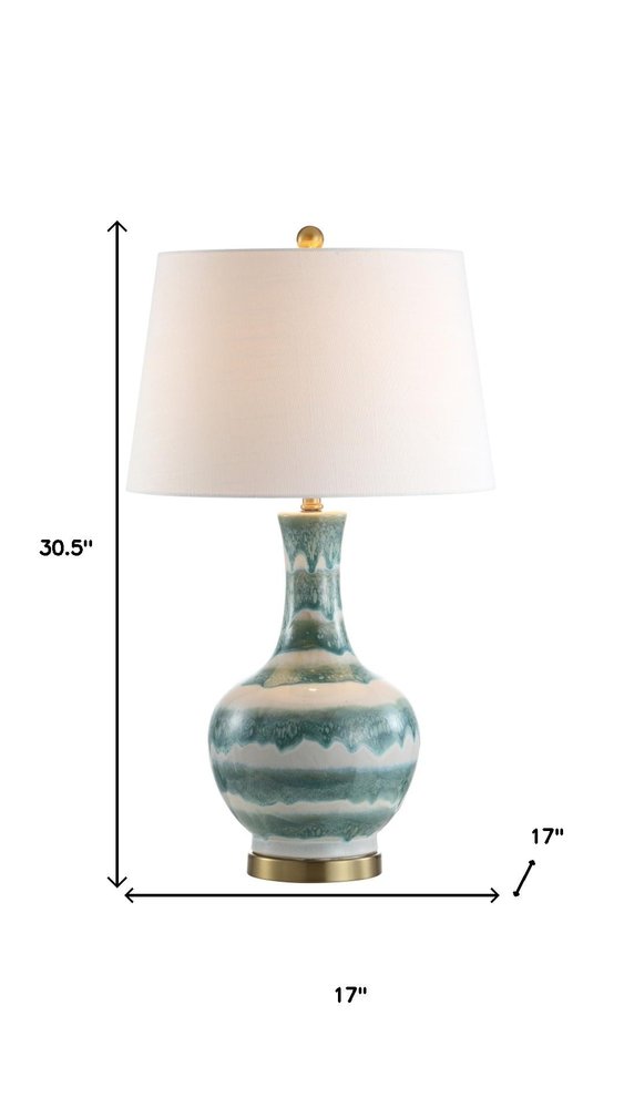 31" Gold Round Table Lamp With Globe Shade. Table lamp isolated on a plain white background.