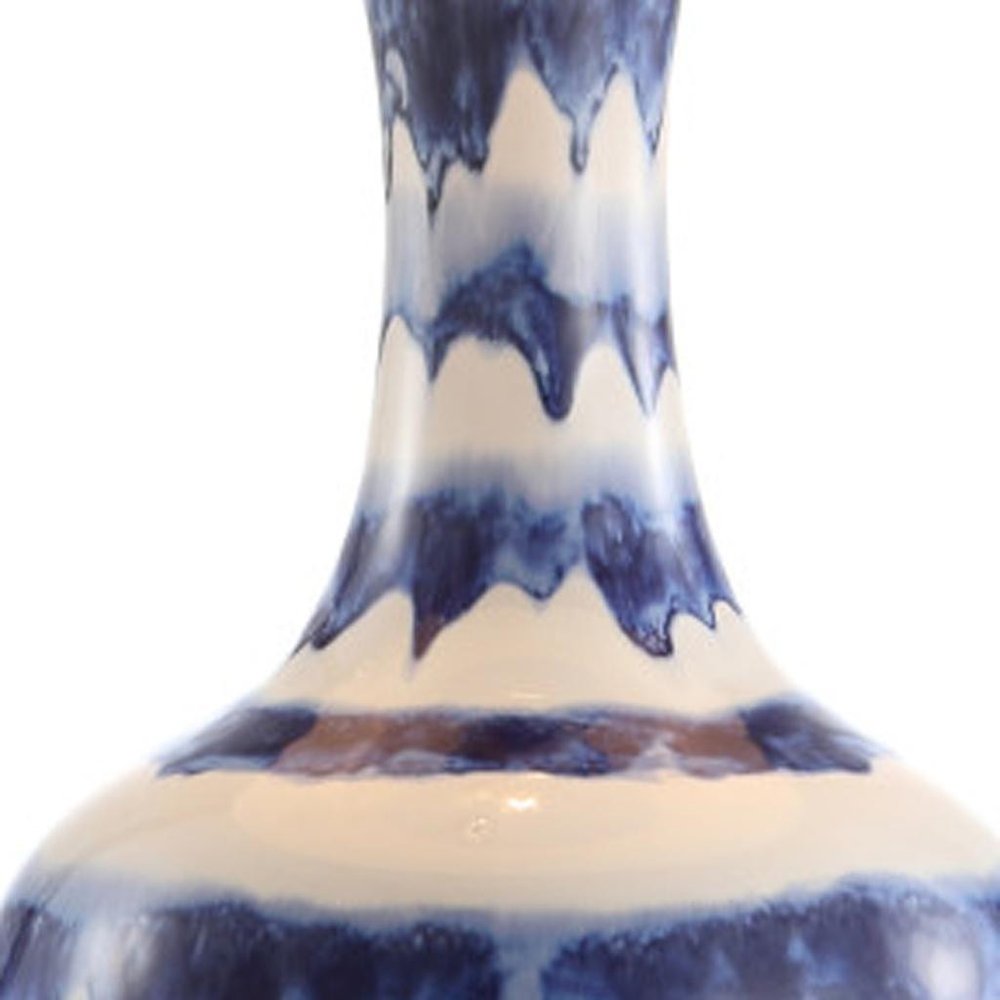 31" Blue White And Gold Novelty Table Lamp With Globe Shade. Table lamp isolated on a plain white background, finished in white.