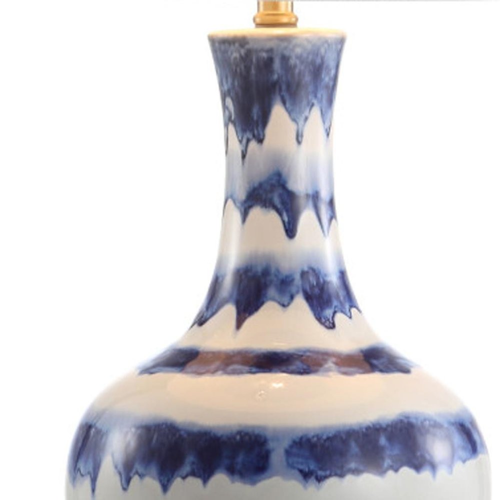 31" Blue White And Gold Novelty Table Lamp With Globe Shade. Table lamp isolated on a plain white background, in a white finish.