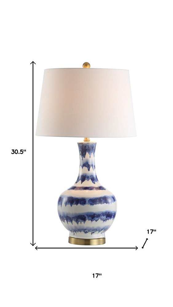 31" Blue White And Gold Novelty Table Lamp With Globe Shade. Table lamp isolated on a plain white background, finished in white.