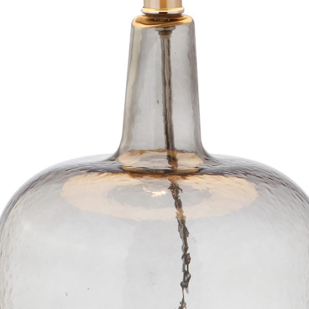 26" Clear Urn Table Lamp With Drum Shade. Table lamp isolated on a plain white background, in a clear finish.