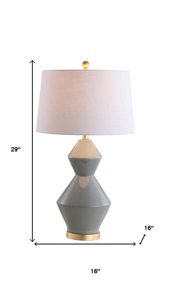 29" Gold Novelty Table Lamp With Globe Shade. Table lamp isolated on a plain white background.