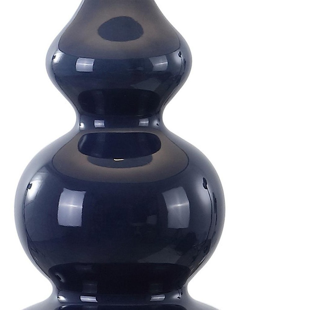 28" Navy Blue And Gold Novelty Table Lamp With Empire Shade. Table lamp isolated on a plain white background, finished in navy.