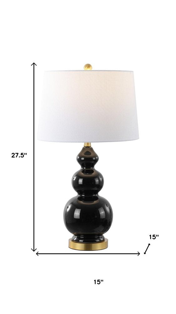 28" Gold Novelty Table Lamp With Drum Shade. Table lamp isolated on a plain white background.