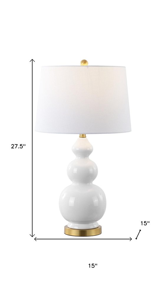 28" Gold Novelty Table Lamp With Drum Shade. Table lamp isolated on a plain white background, showing its gold color.