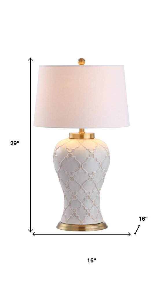 29" Gold Novelty Table Lamp With Drum Shade. Table lamp isolated on a plain white background.