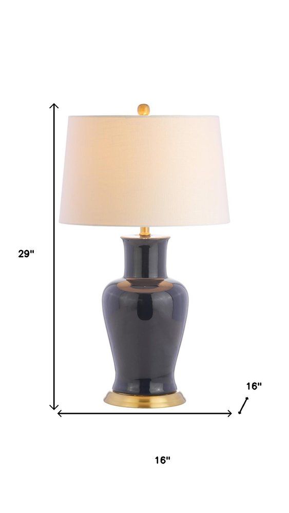 29" Navy Blue And Gold Urn Bedside Lamp With Drum Shade. Lamp isolated on a plain white background, in a navy finish.
