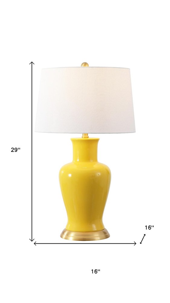 29" Gold Urn Bedside Lamp With Empire Shade. Lamp isolated on a plain white background, showing its gold color.