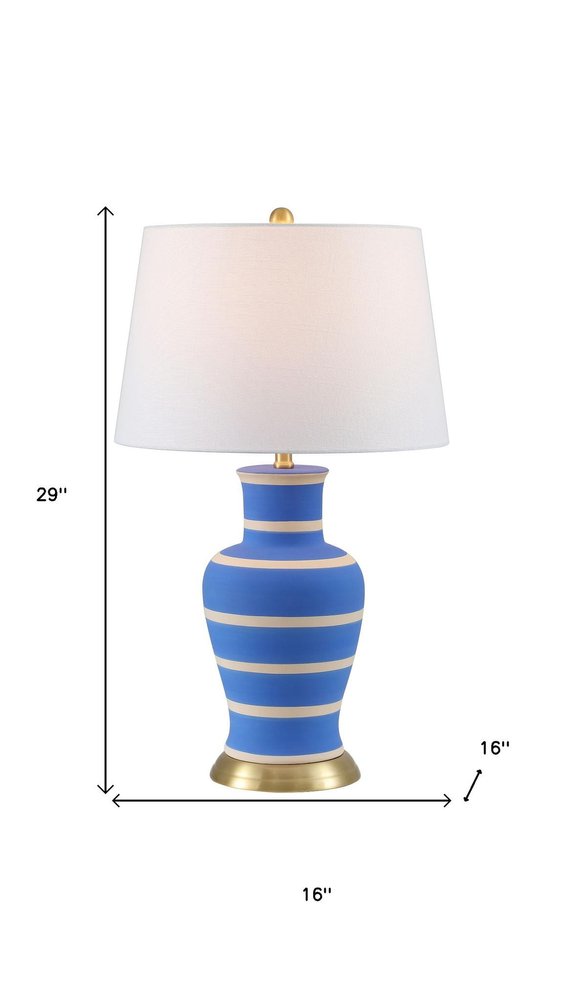 29" Blue Gold And Beige Urn Bedside Lamp With Empire Shade. Lamp isolated on a plain white background, finished in beige.