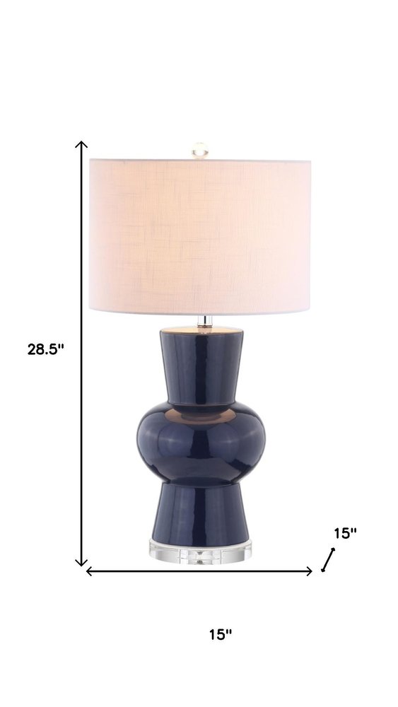 29" Clear Novelty Table Lamp With Drum Shade. Table lamp isolated on a plain white background.