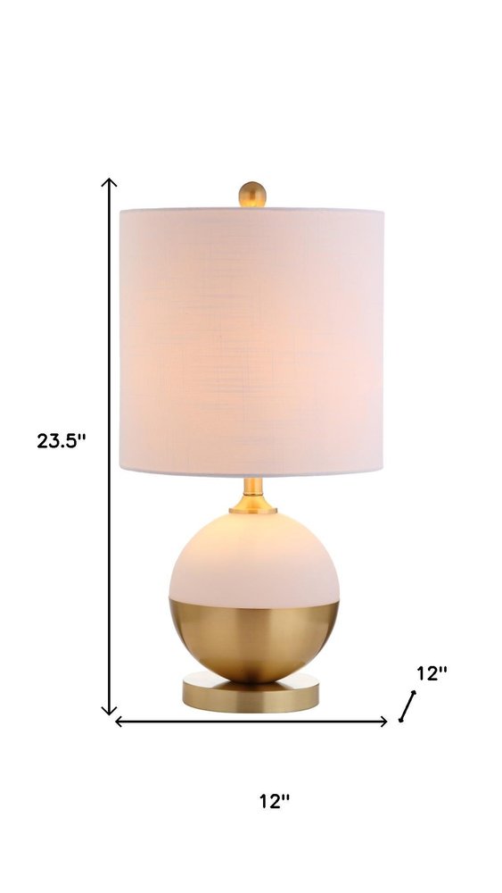 24" Gold Globe Table Lamp With Drum Shade. Table lamp isolated on a plain white background.