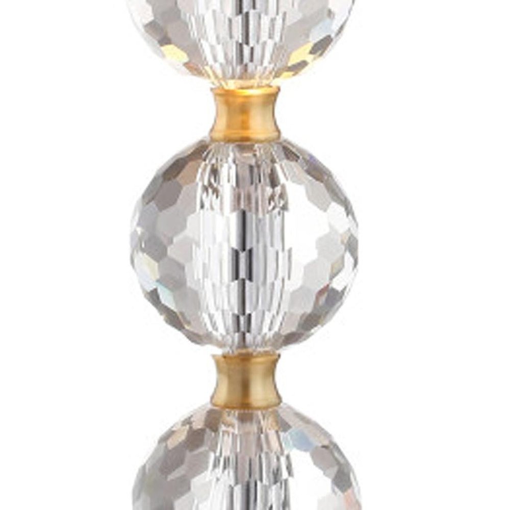 25" Gold Novelty Table Lamp With Drum Shade. Table lamp isolated on a plain white background.