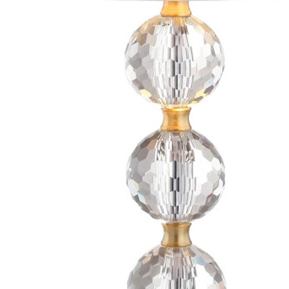 25" Gold Novelty Table Lamp With Drum Shade. Table lamp isolated on a plain white background.