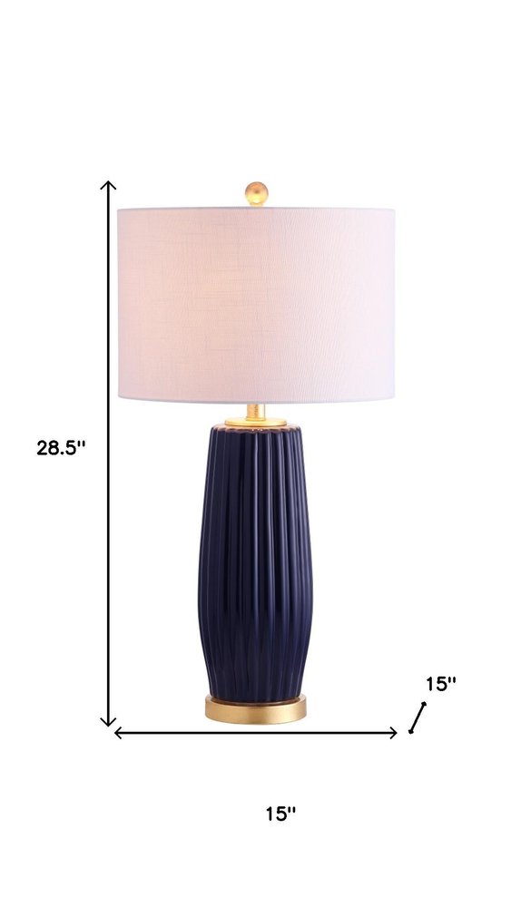 29" Navy Blue And Gold Table Lamp With Drum Shade. Table lamp isolated on a plain white background, showing its navy color.
