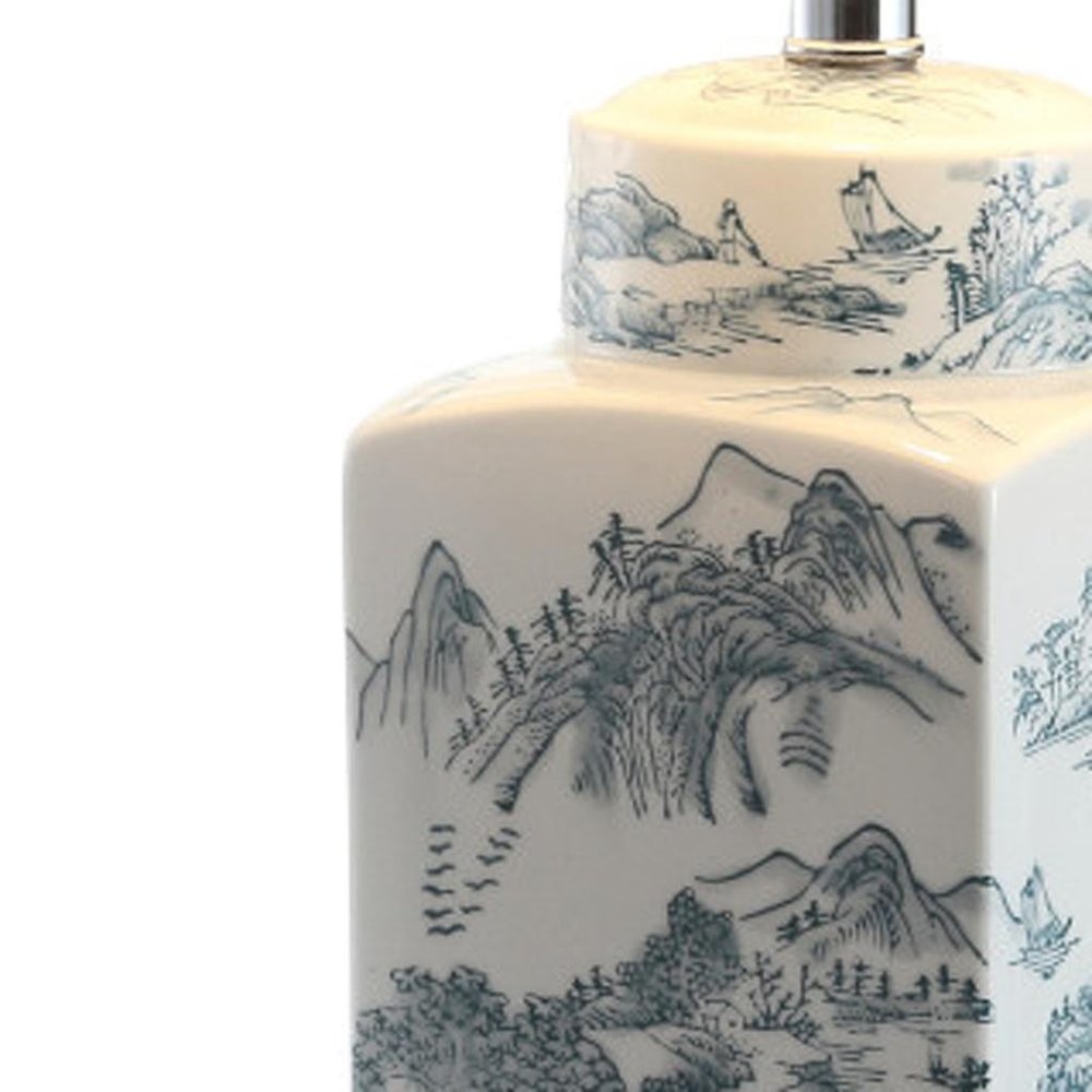 25" Blue And White Table Lamp With Drum Shade. Table lamp isolated on a plain white background, in a white finish.
