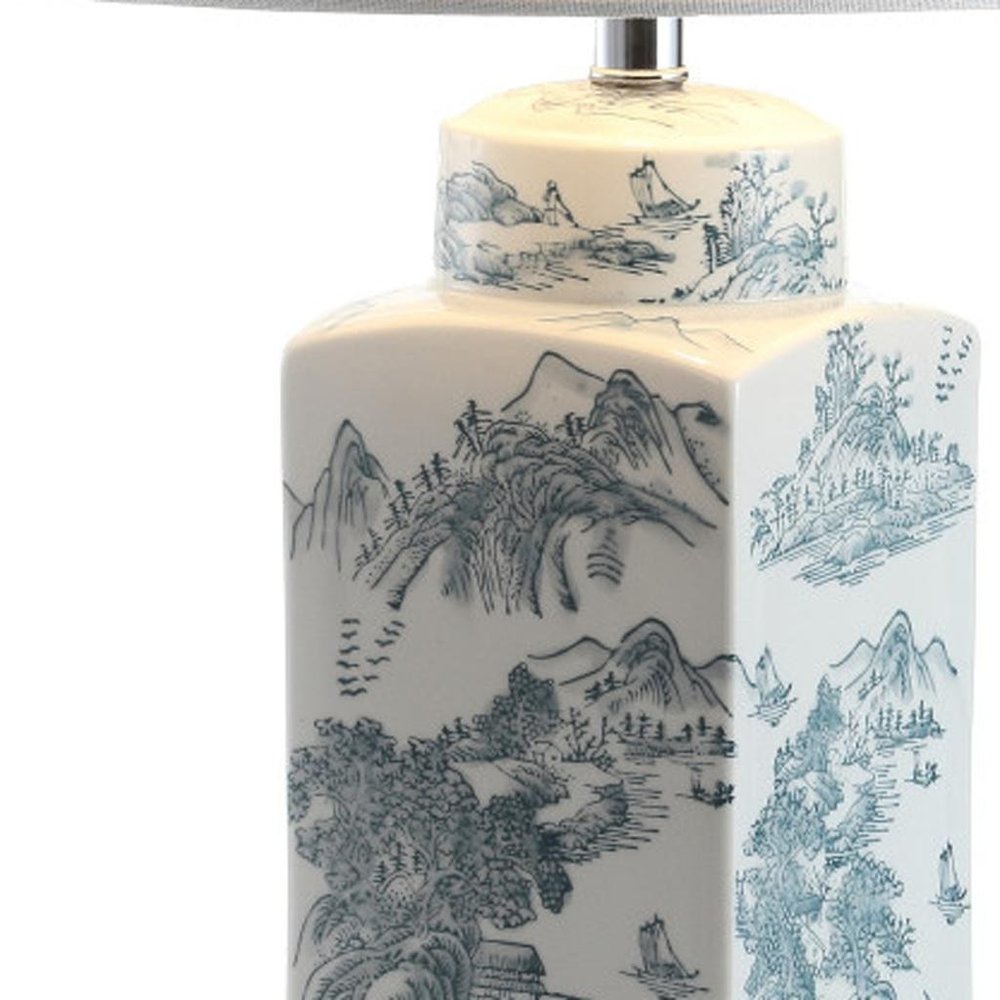 25" Blue And White Table Lamp With Drum Shade. Table lamp isolated on a plain white background, showing its white color.