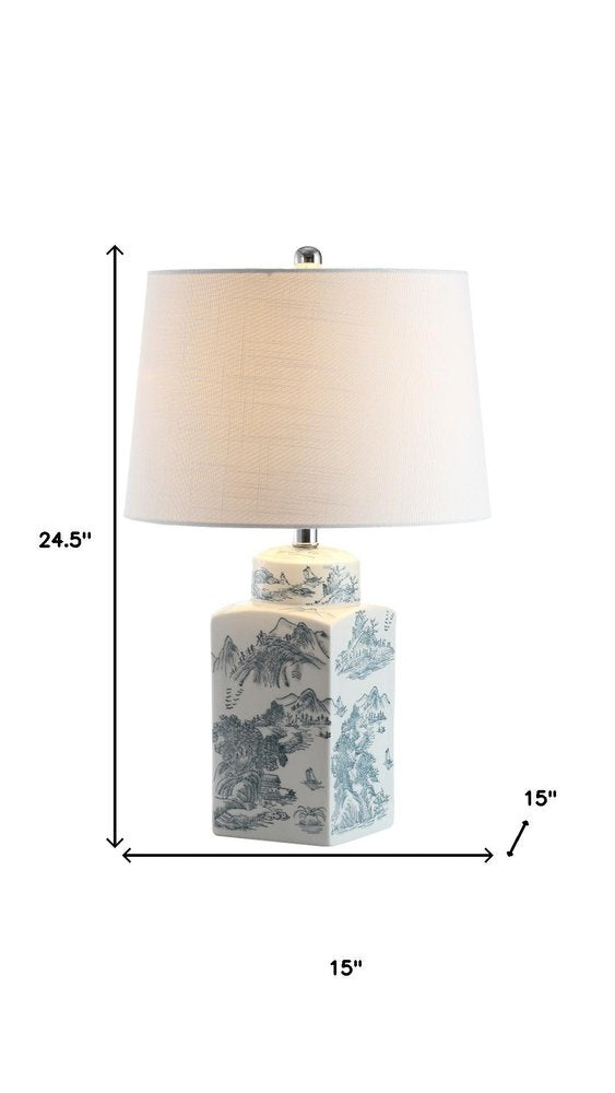 25" Blue And White Table Lamp With Drum Shade. Table lamp isolated on a plain white background, in a white finish.
