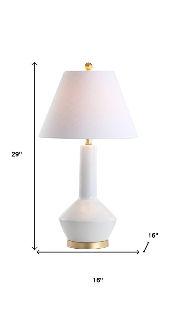 29" White And Gold Urn Table Lamp With Empire Shade. Table lamp isolated on a plain white background, in a white finish.
