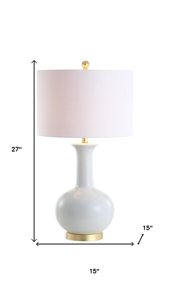 27" White And Gold Novelty Table Lamp With Drum Shade. Table lamp isolated on a plain white background, finished in white.