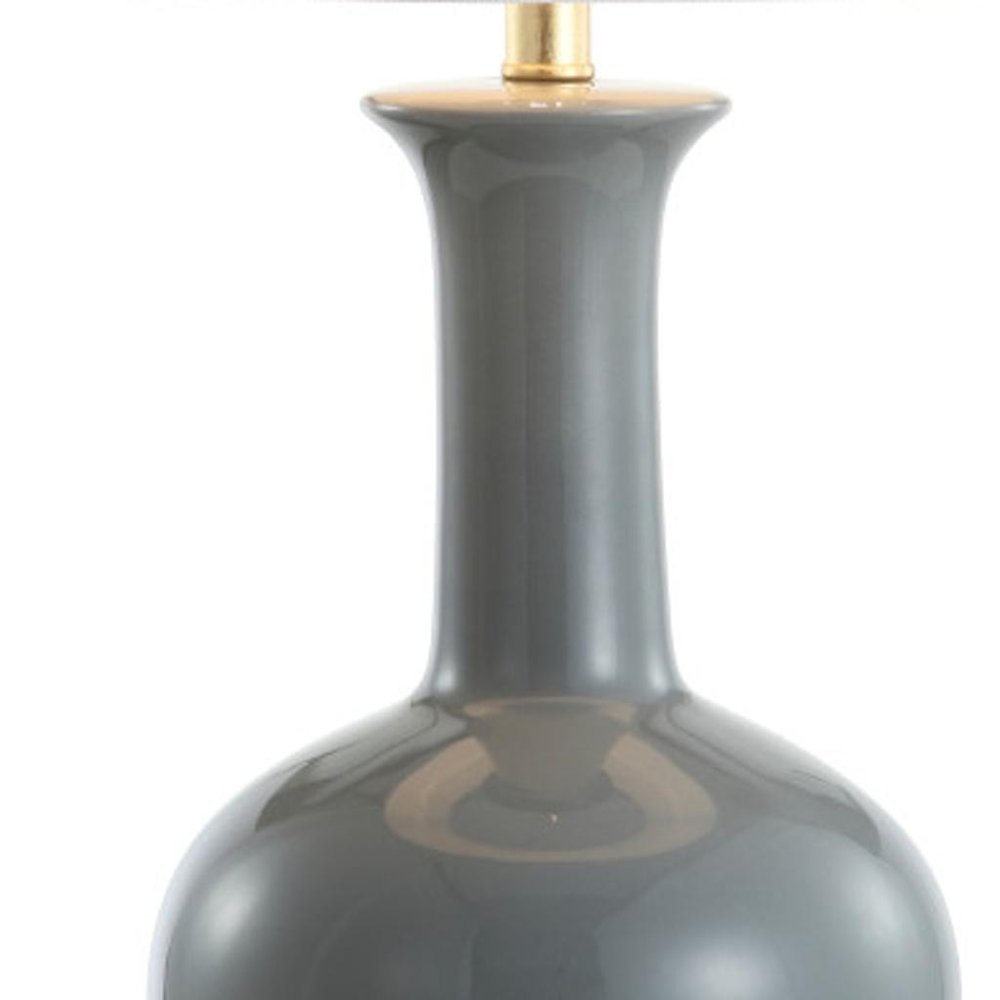 27" Steel Blue And Gold Novelty Table Lamp With Drum Shade. Table lamp isolated on a plain white background, showing a metal surface.