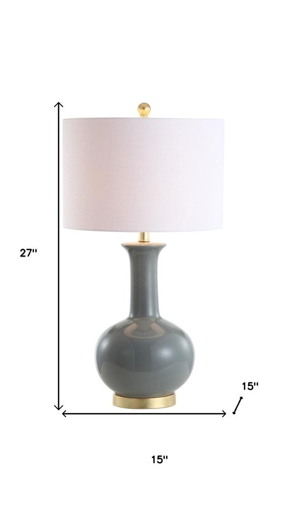 27" Steel Blue And Gold Novelty Table Lamp With Drum Shade. Table lamp isolated on a plain white background, showing a metal surface.