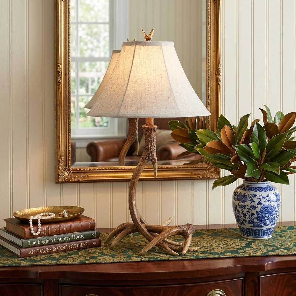 28" Brown Novelty Table Lamp With Globe Shade displayed on a tabletop in a furnished interior against a tan wall.