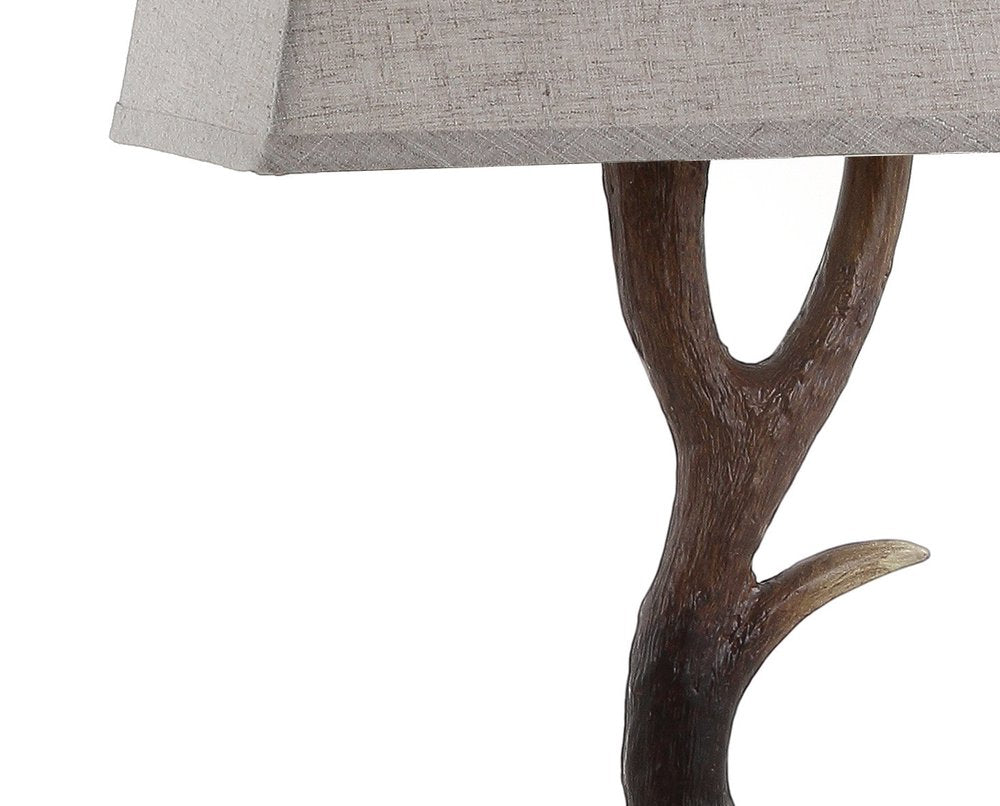 30" Brown And Clear Novelty Table Lamp With Shade. Table lamp isolated on a plain white background, showing its brown color.
