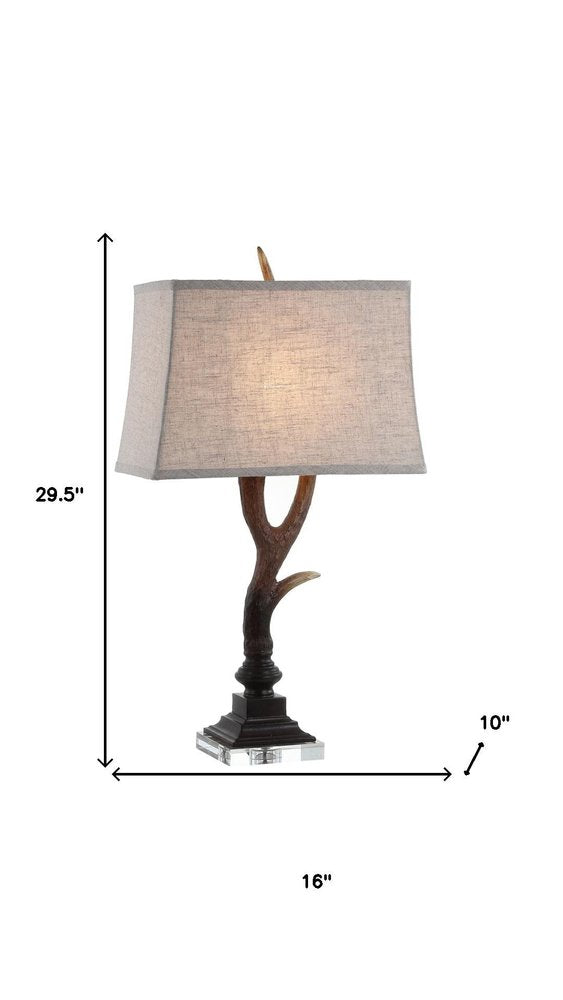 30" Brown And Clear Novelty Table Lamp With Shade. Table lamp isolated on a plain white background, finished in brown.