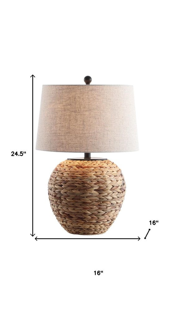 25" Clear Urn Table Lamp With Globe Shade. Table lamp isolated on a plain white background.