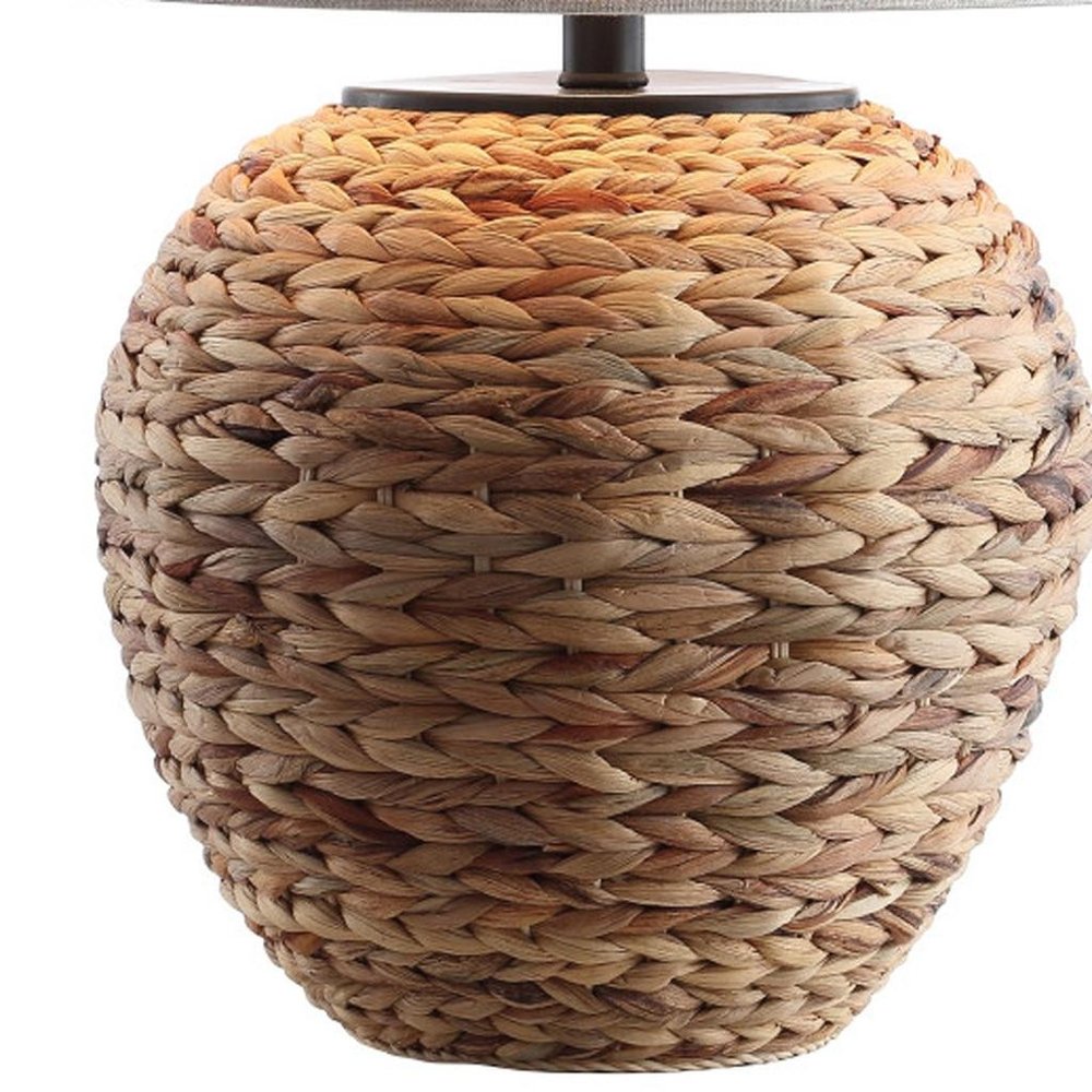 25" Clear Urn Table Lamp With Globe Shade. Table lamp isolated on a plain white background.