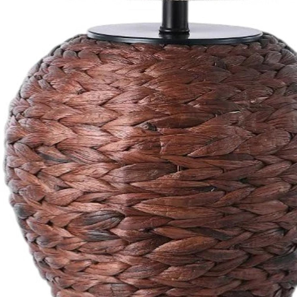 25" Clear Urn Table Lamp With Globe Shade detail shot of the surface finish.