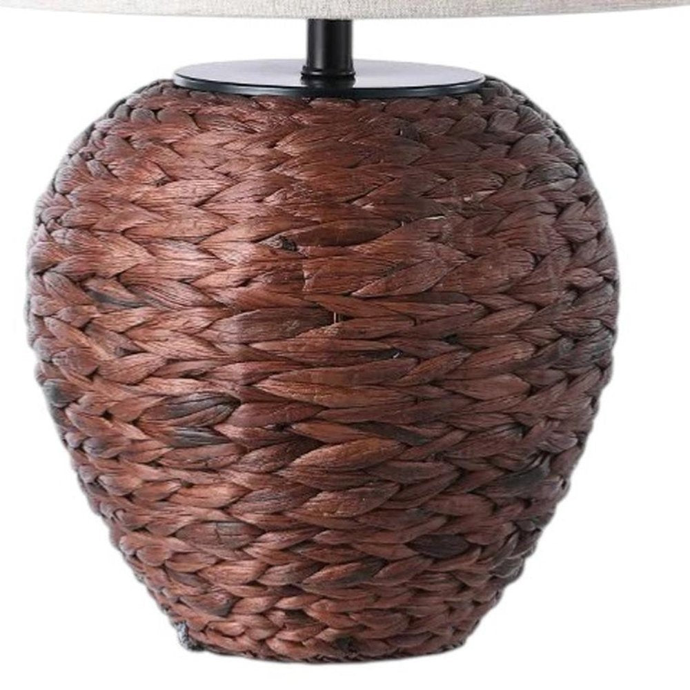 25" Clear Urn Table Lamp With Globe Shade. Table lamp isolated on a plain white background.