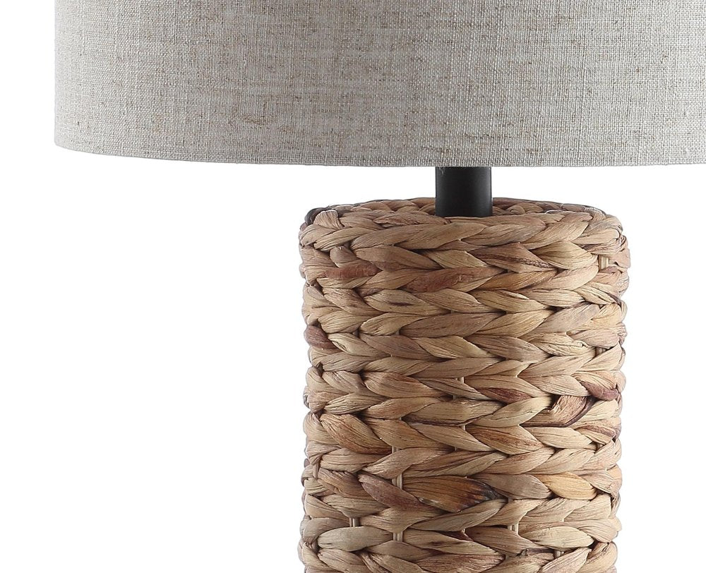 Set of Two 25" Natural And Black Bedside Lamps With Drum Shades on a white background
