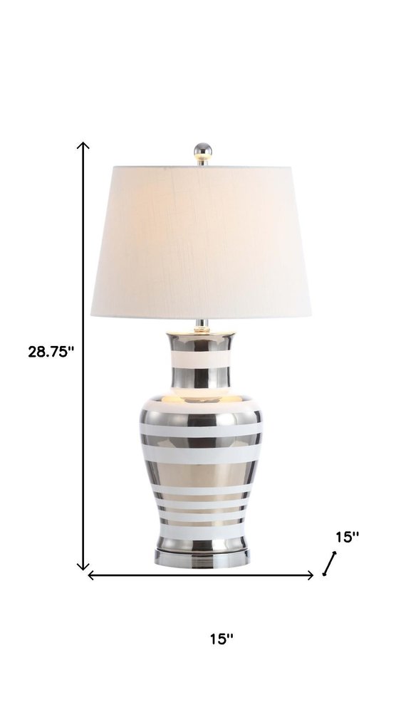 29" Silver Urn Table Lamp With Empire Shade. Table lamp isolated on a plain white background, in a silver finish.