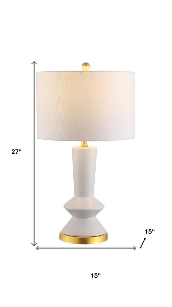 27" White And Gold Geometric Table Lamp With Drum Shade. Table lamp isolated on a plain white background, showing its white color.