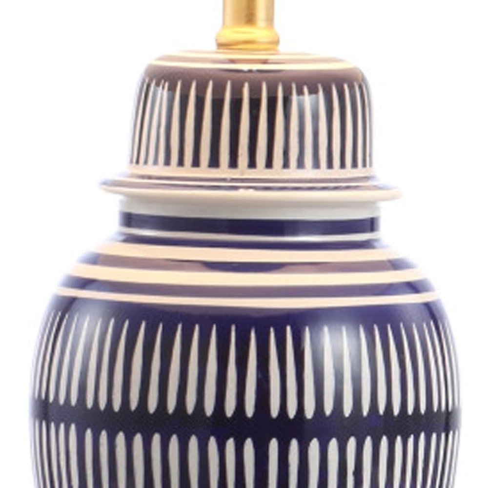 27" Navy Blue Gold And White Urn Table Lamp With Empire Shade. Table lamp isolated on a plain white background, in a white finish.