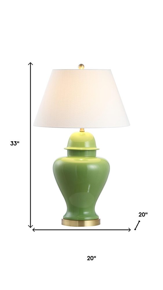 33" Green And Gold Urn Table Lamp With Empire Shade. Table lamp isolated on a plain white background, finished in green.