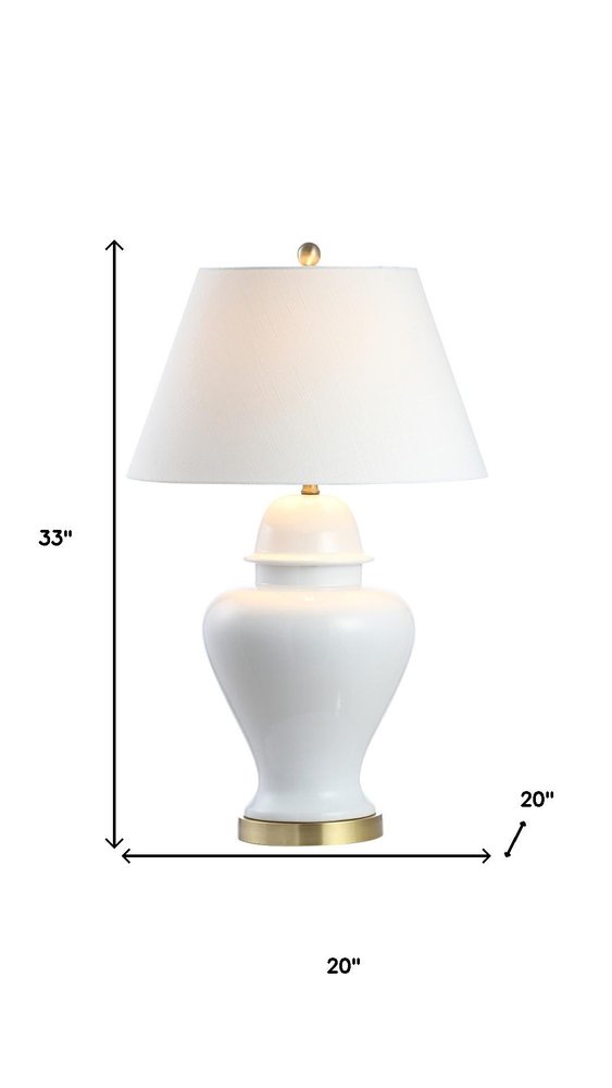 33" White And Gold Urn Table Lamp With Empire Shade. Table lamp isolated on a plain white background, in a white finish.