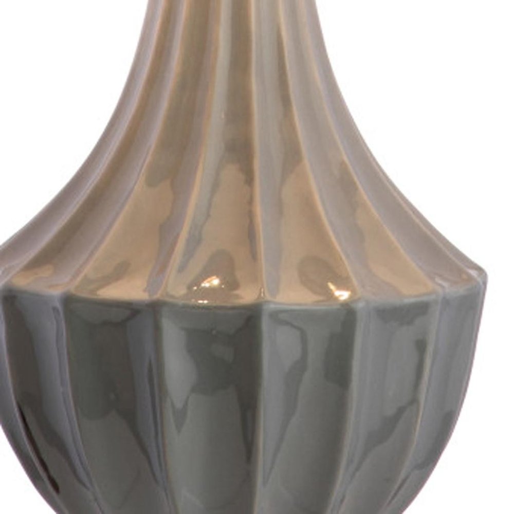 25" Gray And Clear Novelty Table Lamp With Drum Shade. Table lamp isolated on a plain white background, in a gray finish.