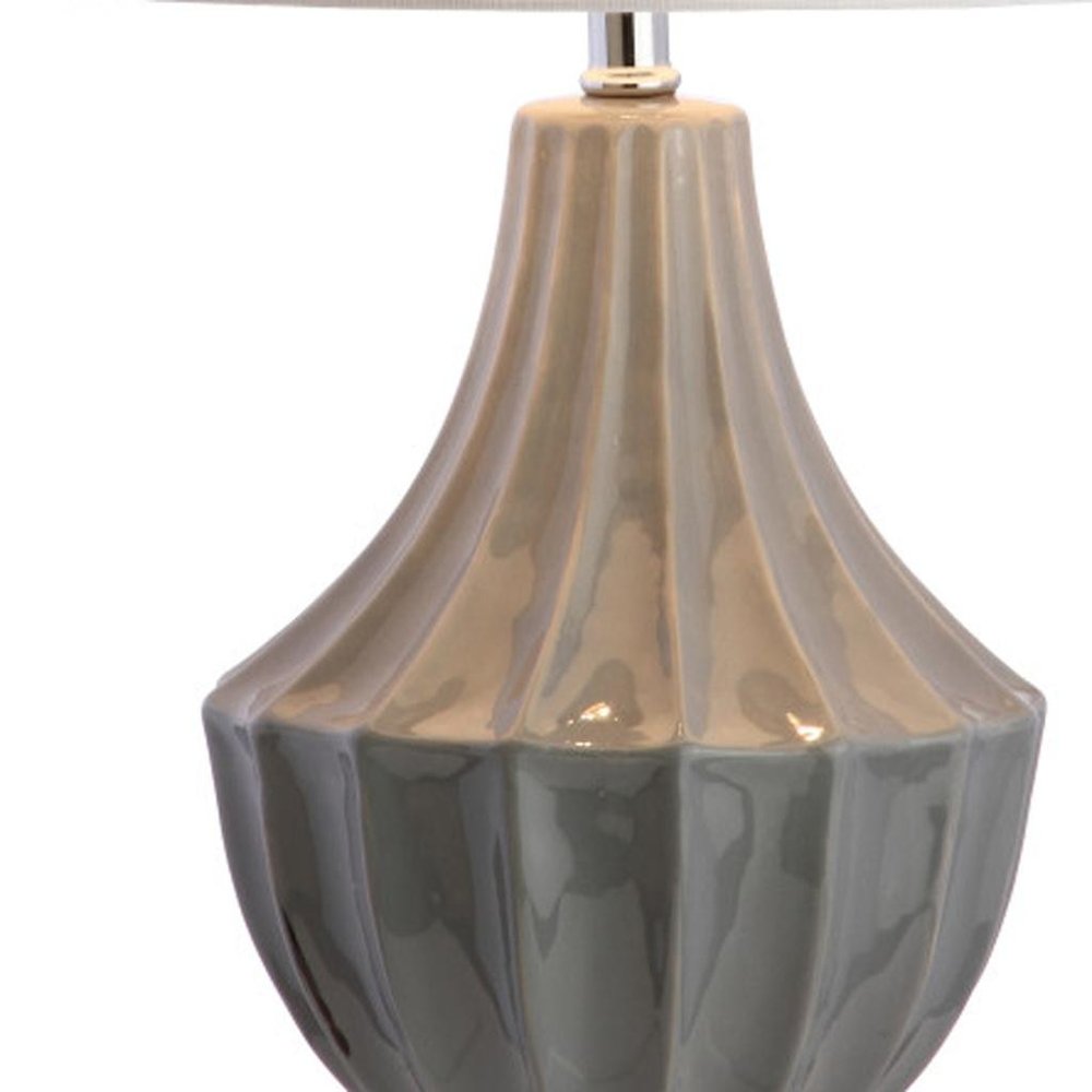 25" Gray And Clear Novelty Table Lamp With Drum Shade. Table lamp isolated on a plain white background, finished in gray.