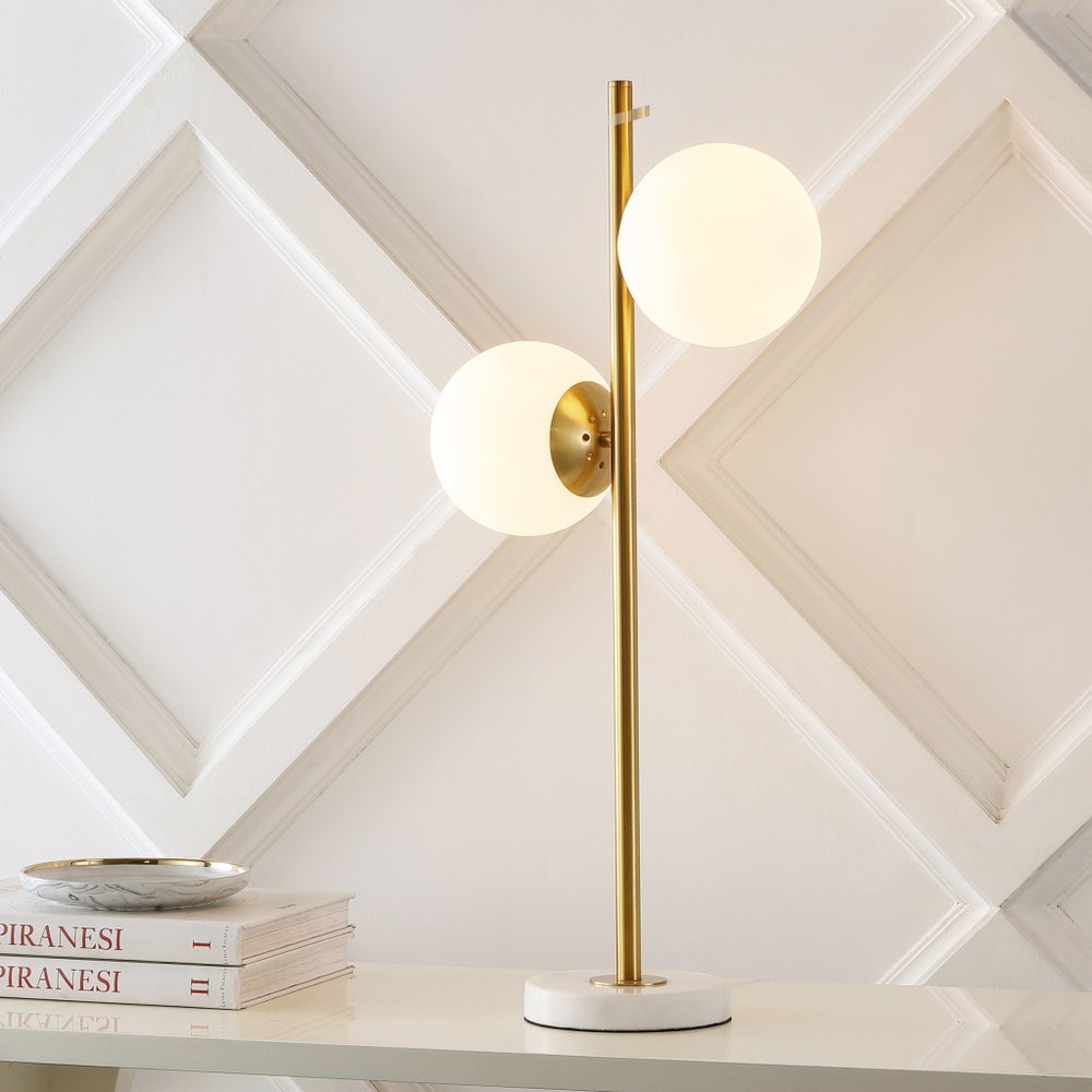 28" White Table Lamp With Globe Shade. Table lamp isolated on a plain white background, showing its white color.