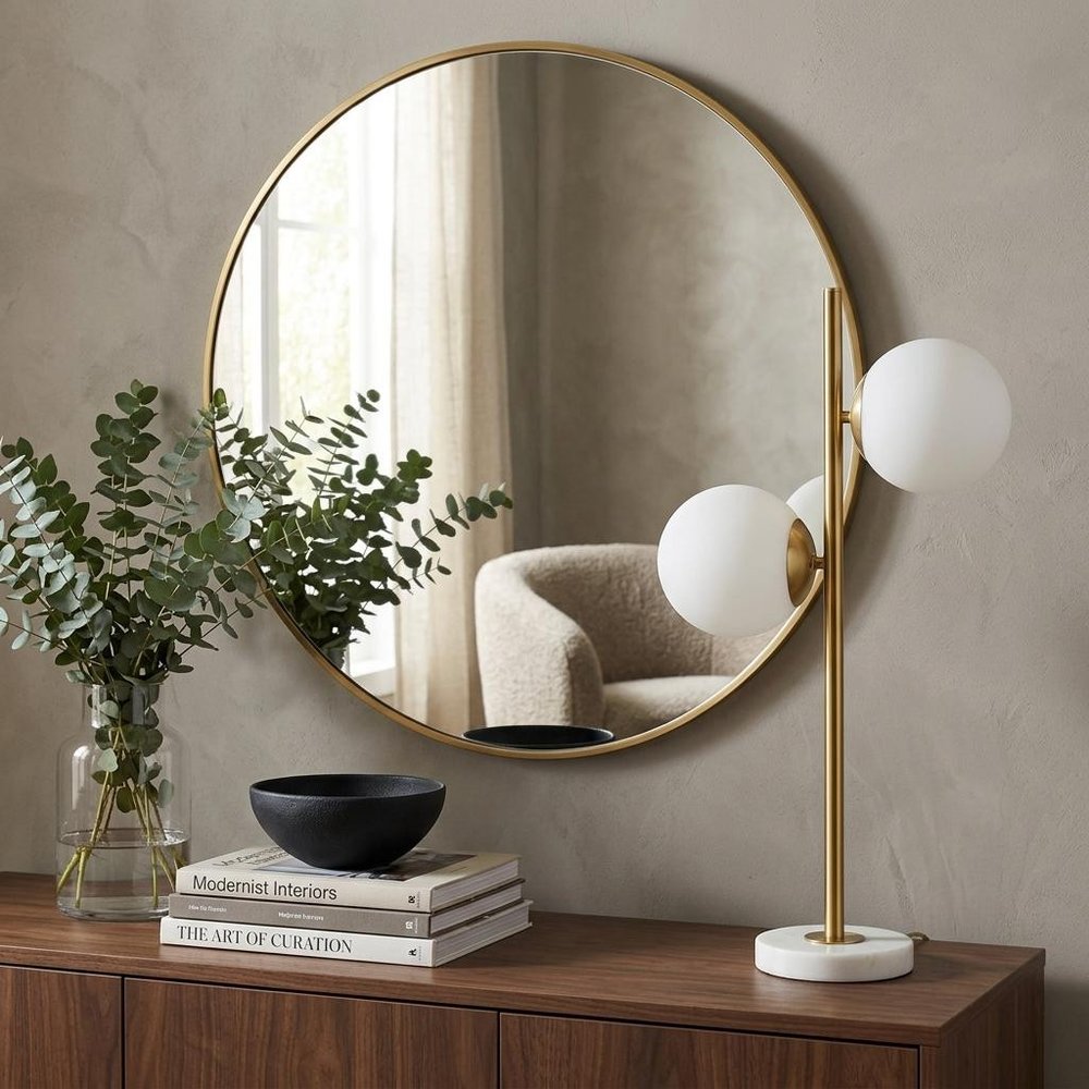 28" White Table Lamp With Globe Shade displayed on a dark wood tabletop in a furnished interior against a tan wall.