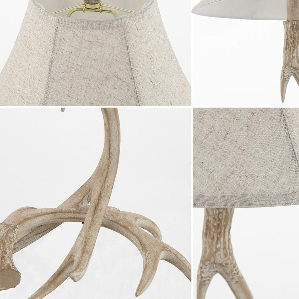 28" Beige Antlers Table Lamp With Bell Shade. Table lamp isolated on a plain white background, in a beige finish.