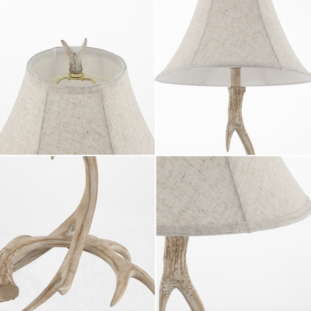 28" Beige Antlers Table Lamp With Bell Shade. Table lamp isolated on a plain white background, showing its beige color.