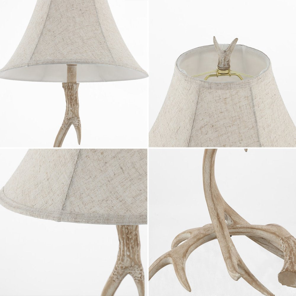 28" Beige Antlers Table Lamp With Bell Shade. Table lamp isolated on a plain white background, finished in beige.