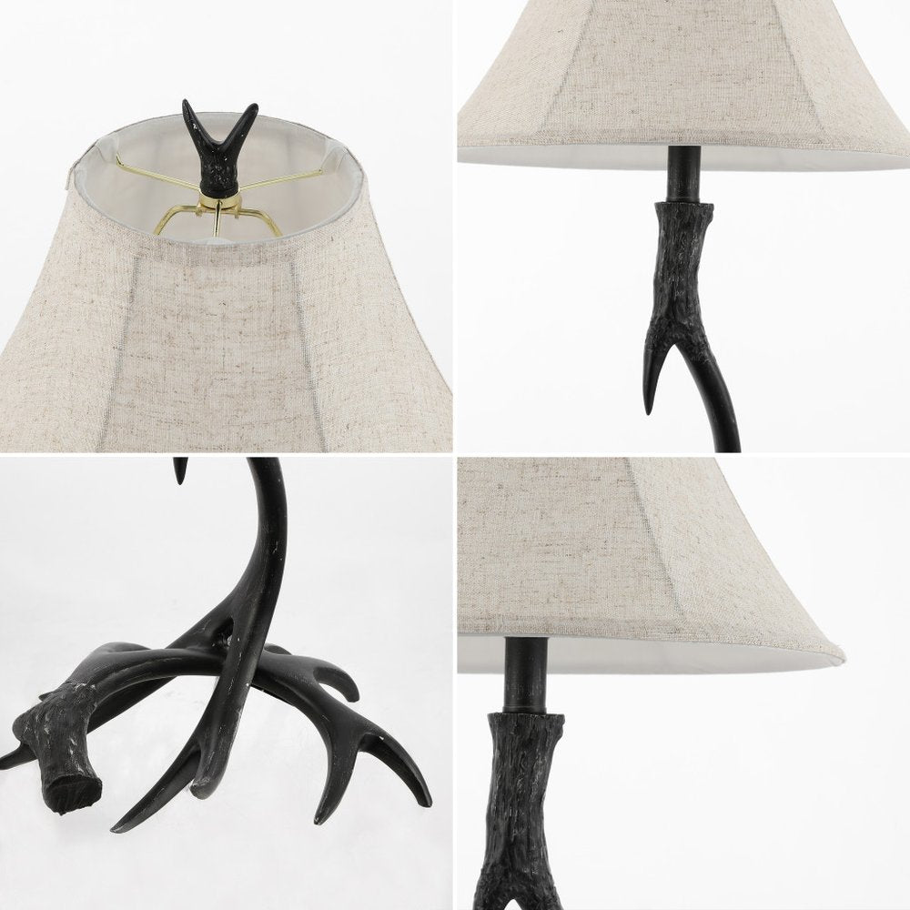 28" Black Antlers Table Lamp With Bell Shade. Table lamp isolated on a plain white background.
