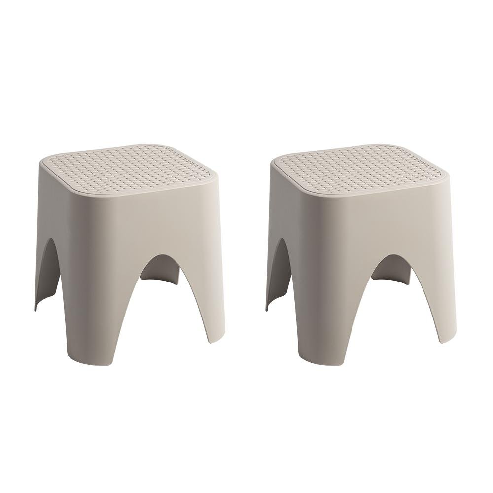 15" Plastic Outdoor Footstool Ottoman. Outdoor ottoman isolated on a plain white background, showing a plastic surface.