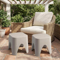 15" Plastic Outdoor Footstool Ottoman shown outdoors on a patio.